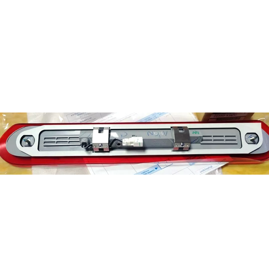 Nissan Genuine Parts label showing part number 26590-4JA0C and brake lamp assembly