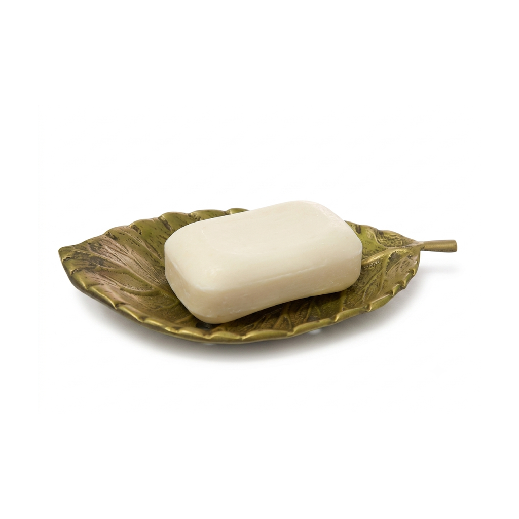 Solid brass leaf soap dish with antique gold finish, shown with a bar of soap
