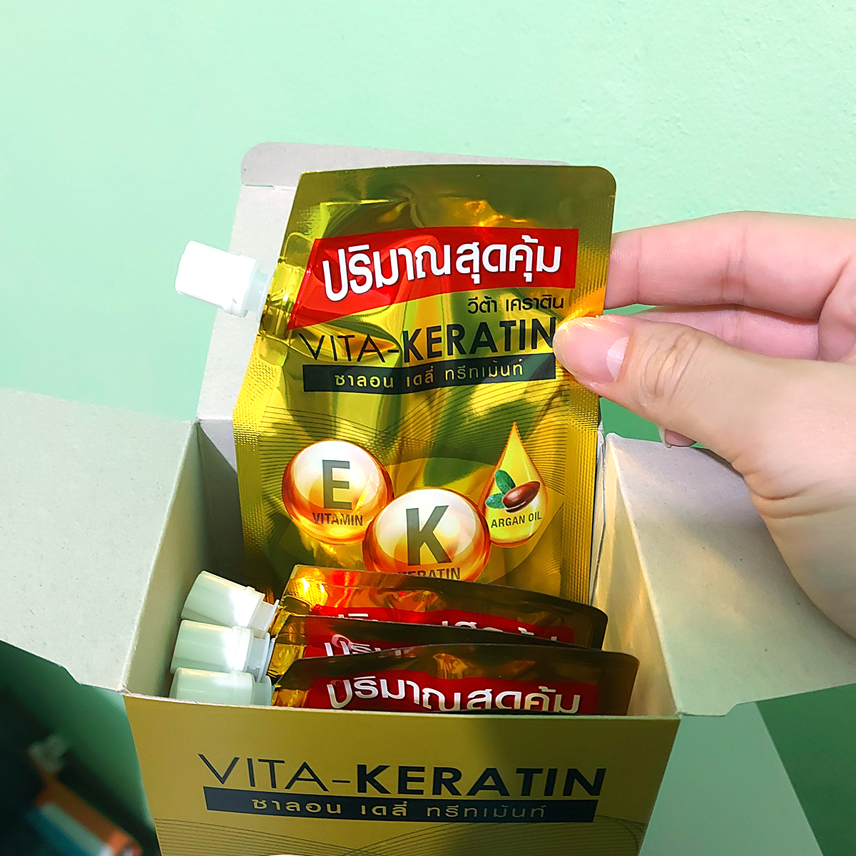 Vita-Keratin Salon Daily Treatment 50 ml pouch held in hand