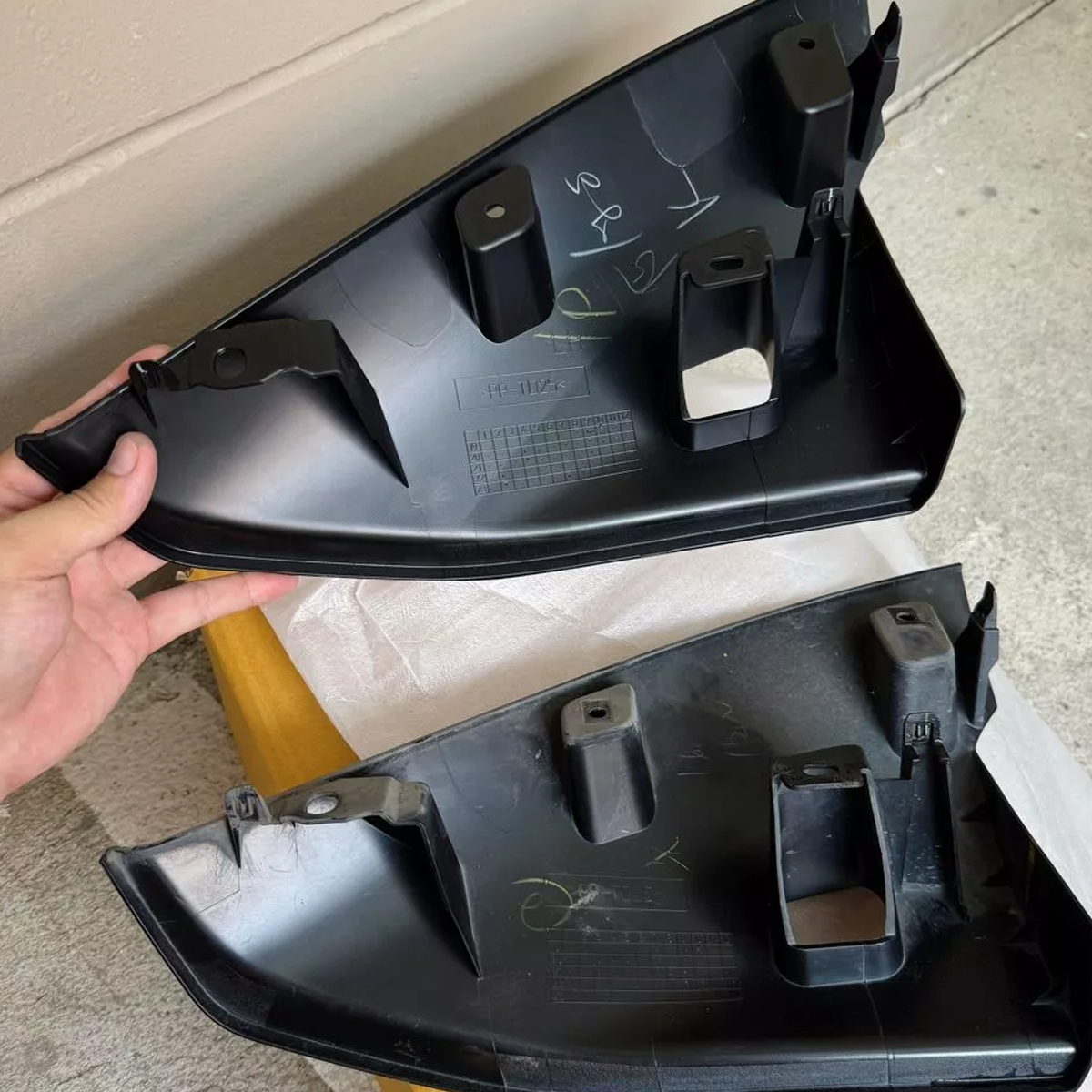 Isuzu D-MAX front bumper extension pair showing back side mounting clips